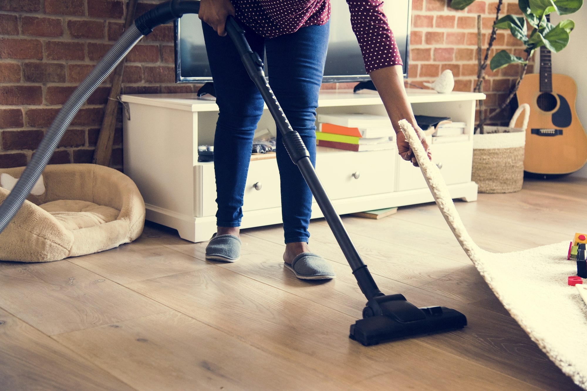 Black woman is cleaning room